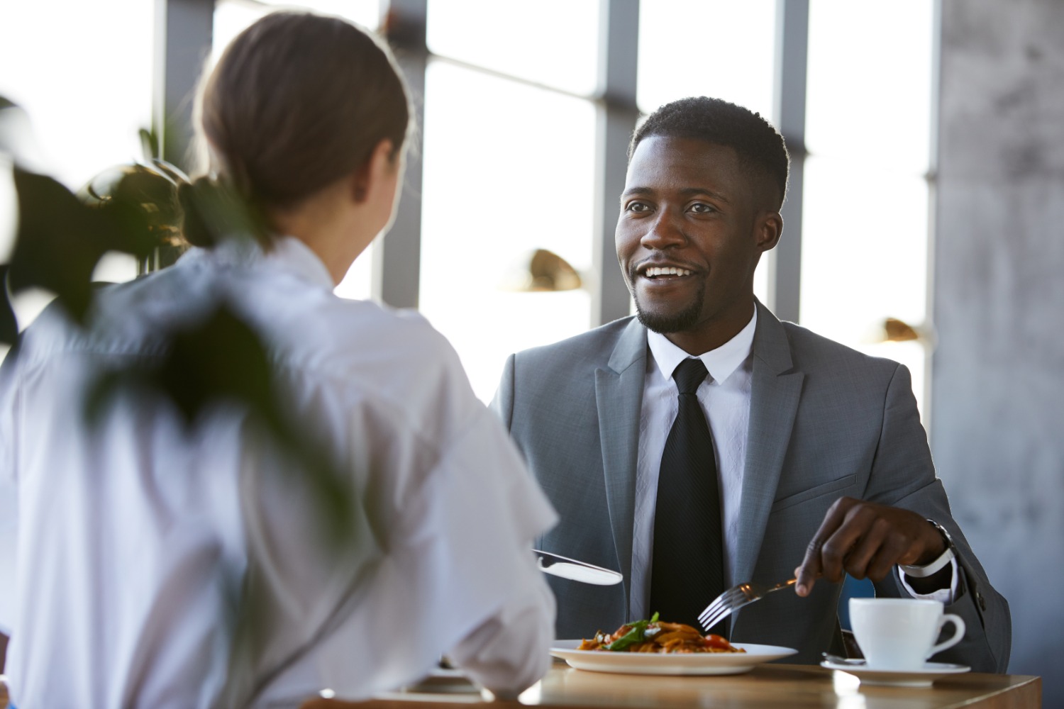Businessman and businesswoman eating