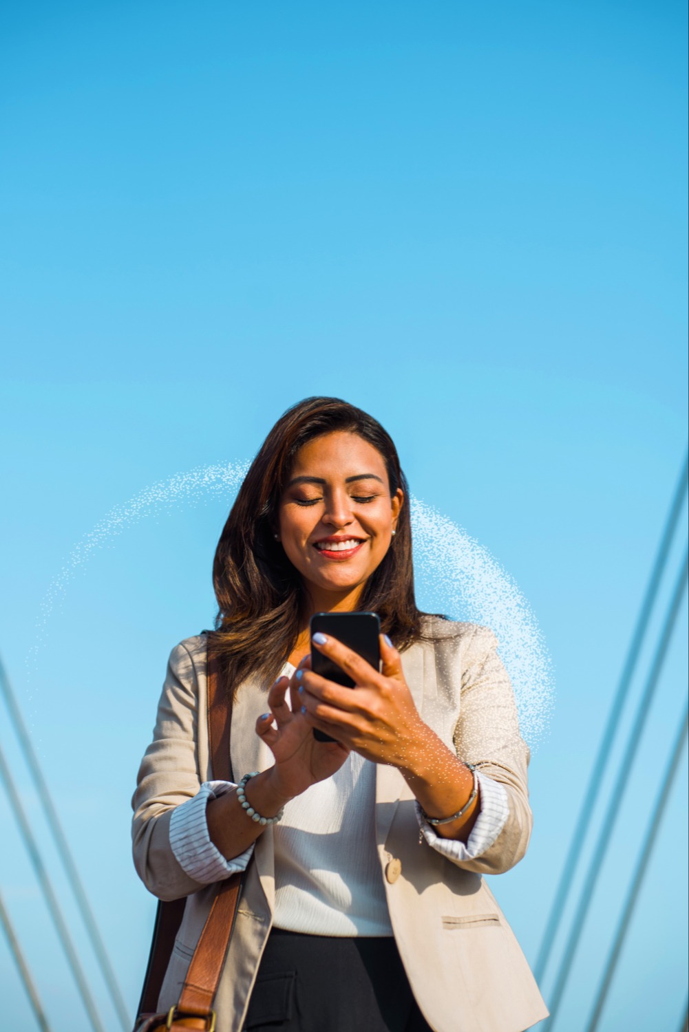 Smiling woman holding phone