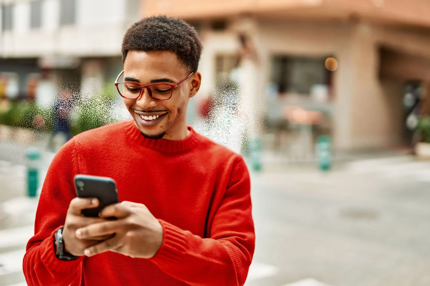 Man smiling at a phone