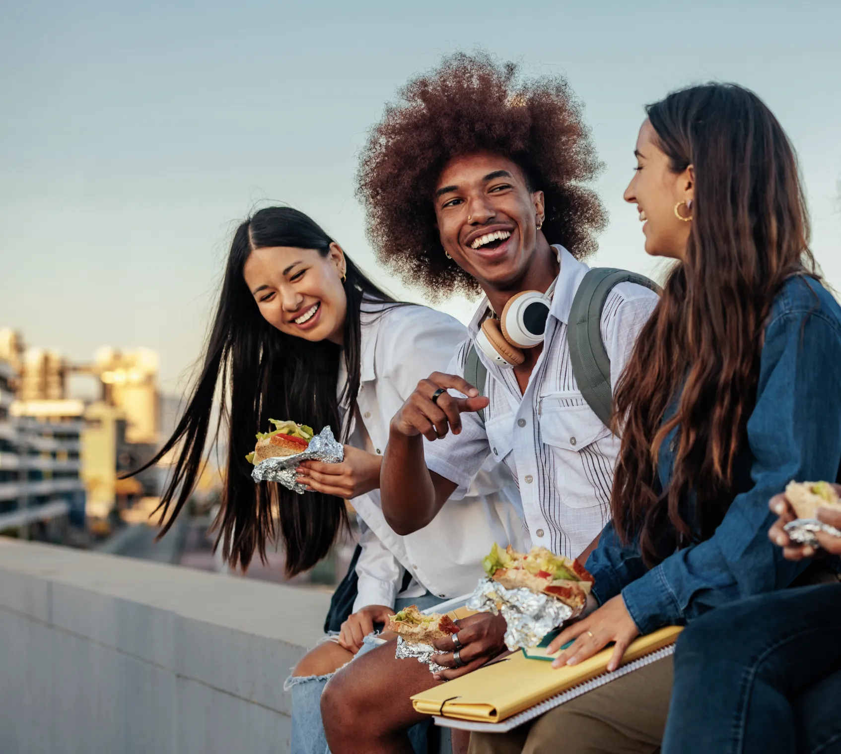 Group of students smiling and eating
