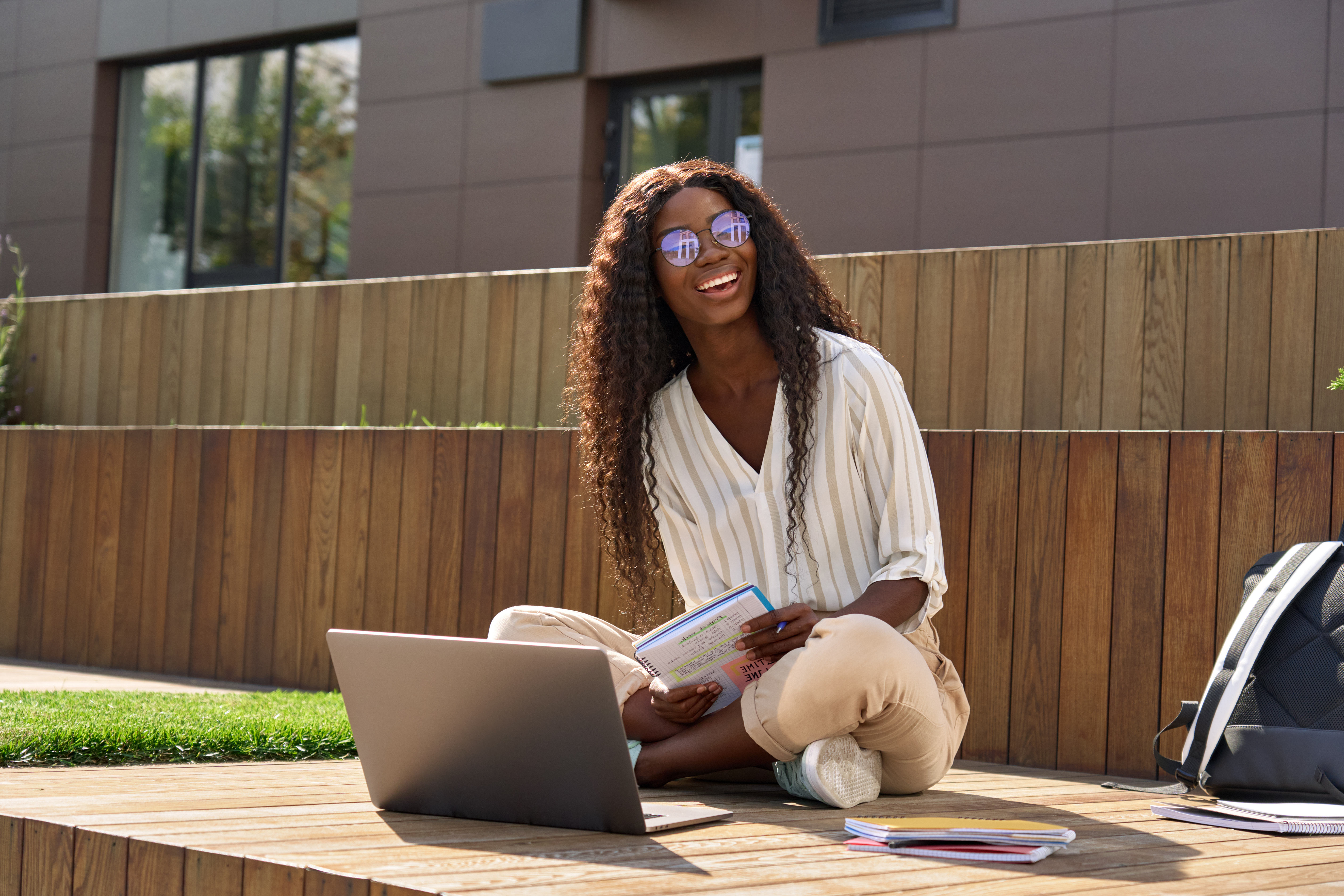 Smiling woman looking at laptop