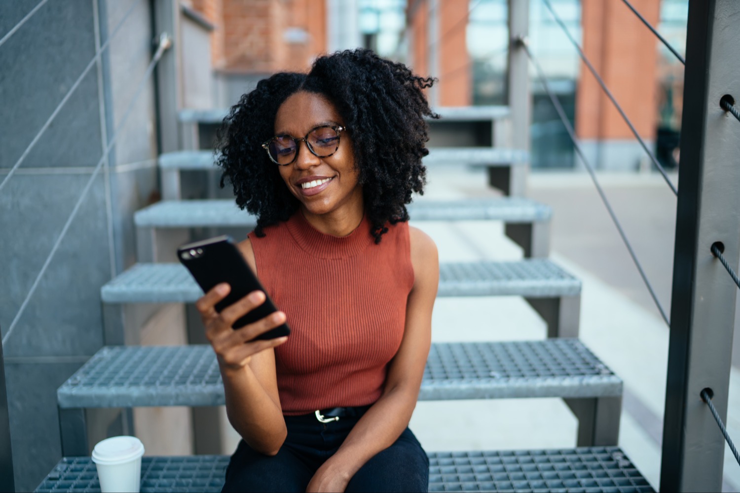 Smiling woman using phone