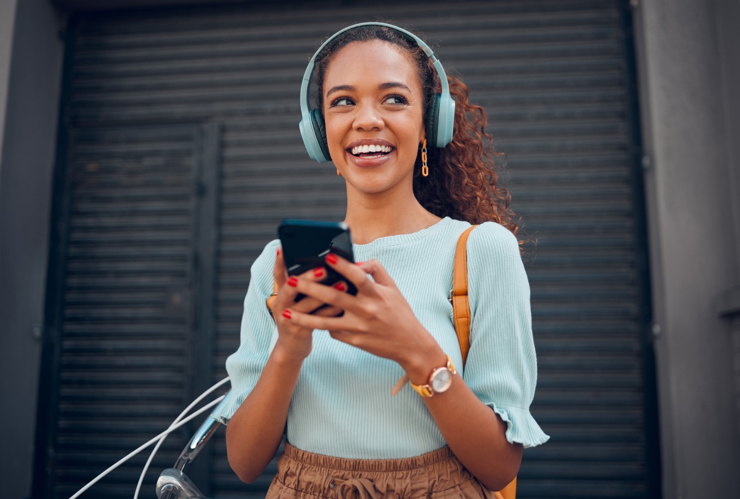 Smiling woman using phone