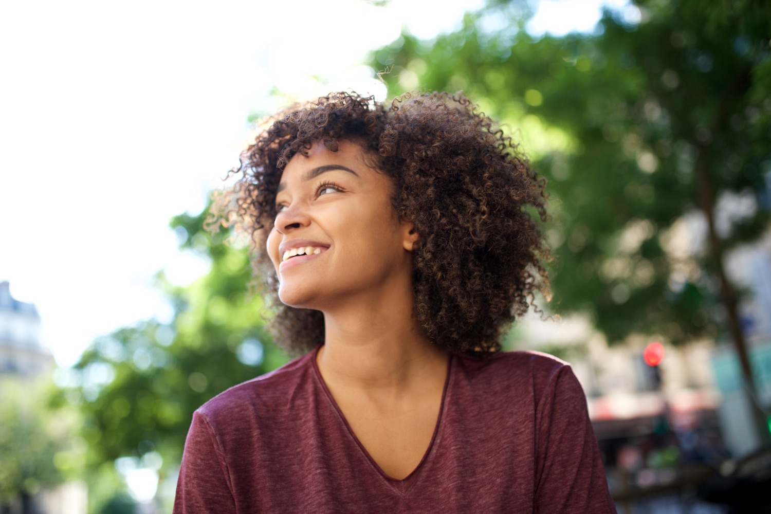 Smiling woman using phone